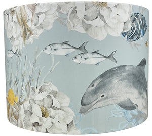 ocean-themed lampshade with vibrant sea creatures, including dolphins and turtles.