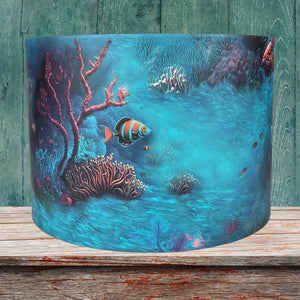 Underwater-themed lampshade with a variety of sea creatures, set against a calming light blue background.