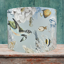 Load image into Gallery viewer, Children&#39;s lampshade with colorful sea creatures, perfect for a nautical-themed bedroom.