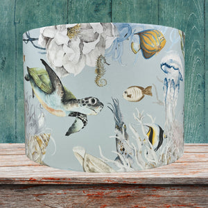 Children's lampshade with colorful sea creatures, perfect for a nautical-themed bedroom.