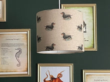 Load image into Gallery viewer, dachshund lampshade showcasing detailed sausage dog patterns on a beige background.