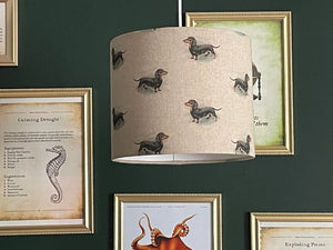 dachshund lampshade showcasing detailed sausage dog patterns on a beige background.